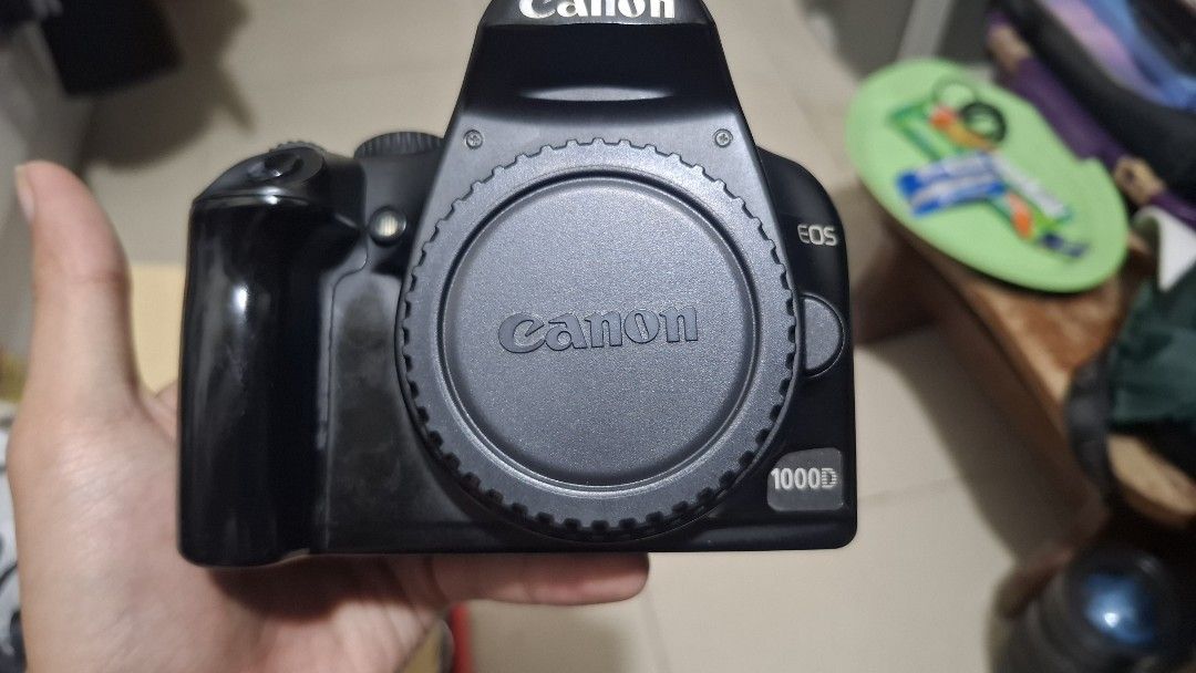 Canon EOS 1000D DSLR Camera (Category: Cameras) located in Quezon City. Submitted by parkjooyeon07 (Listing ID 1396864612, Image 1). Description: - Canon EOS 1000D DSLR camera - Features a Canon lens mount - Rear LCD screen - Control buttons - Flash hot shot - SD card slot - Black camera body - with battery and charger issue: power board issue .
