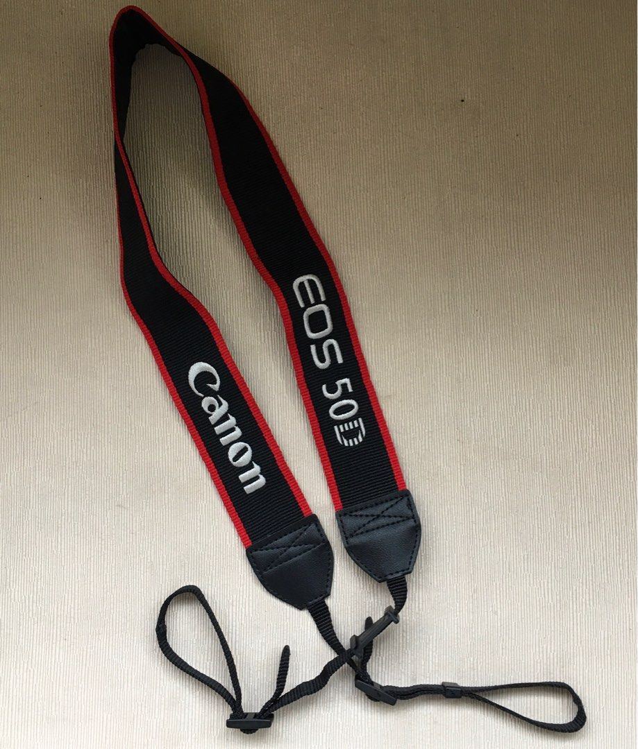 Classic Canon 50D EOS Strap (Category: Other Photography Accessories) located in Tarlac. Submitted by greatfindstrlc (Listing ID 1396919363, Image 1). Description: Good condition no wearing but an issue on the belt strap. Former owner had cut the ends of both sides. Had Speedyman sawed it back together using hard black shoe thread to make it seemless, un-noticeable, strong and sturdy. Maybe the former owner doesn’t know how to replace or remove t