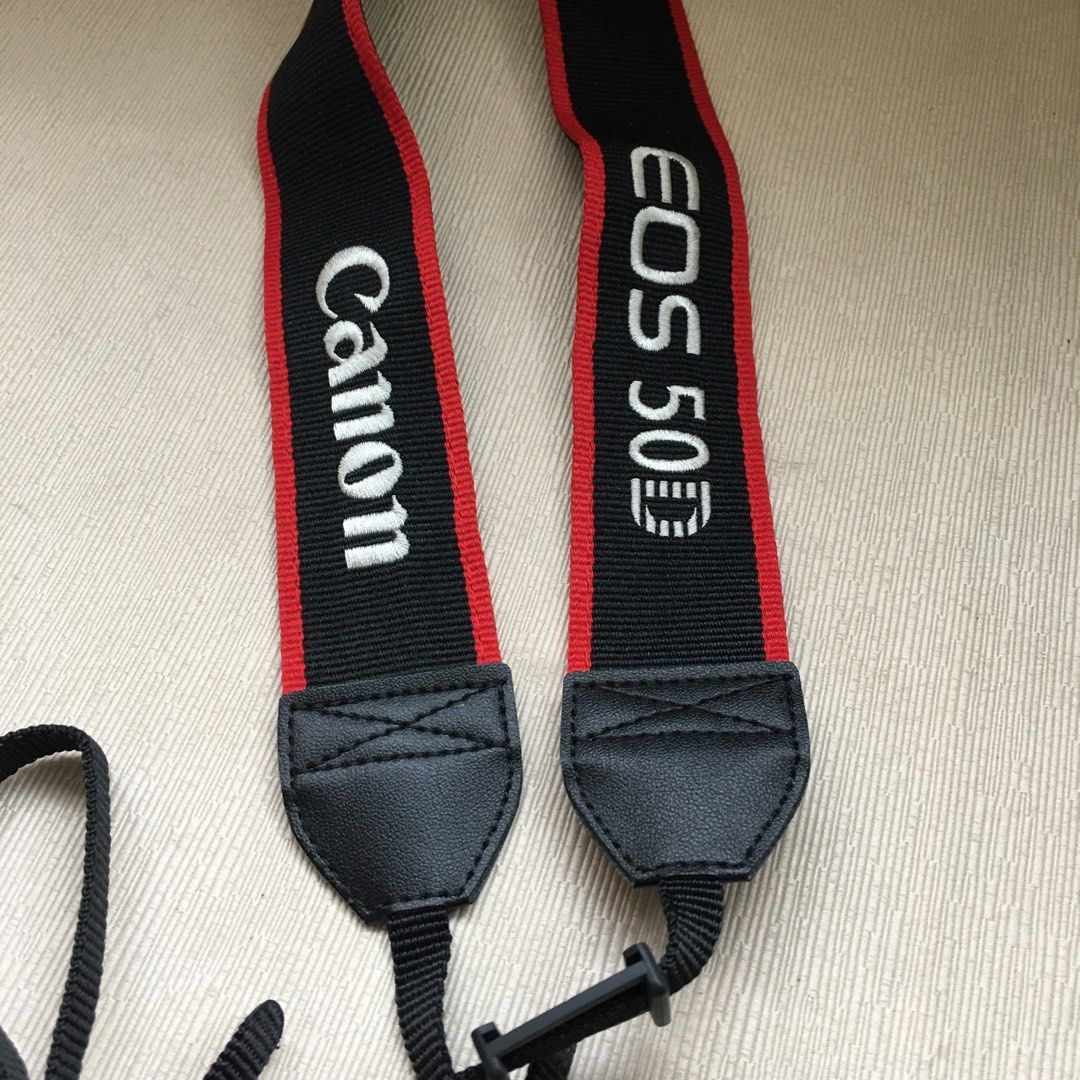 Classic Canon 50D EOS Strap (Category: Other Photography Accessories) located in Tarlac. Submitted by greatfindstrlc (Listing ID 1396919363, Image 2). Description: Good condition no wearing but an issue on the belt strap. Former owner had cut the ends of both sides. Had Speedyman sawed it back together using hard black shoe thread to make it seemless, un-noticeable, strong and sturdy. Maybe the former owner doesn’t know how to replace or remove t