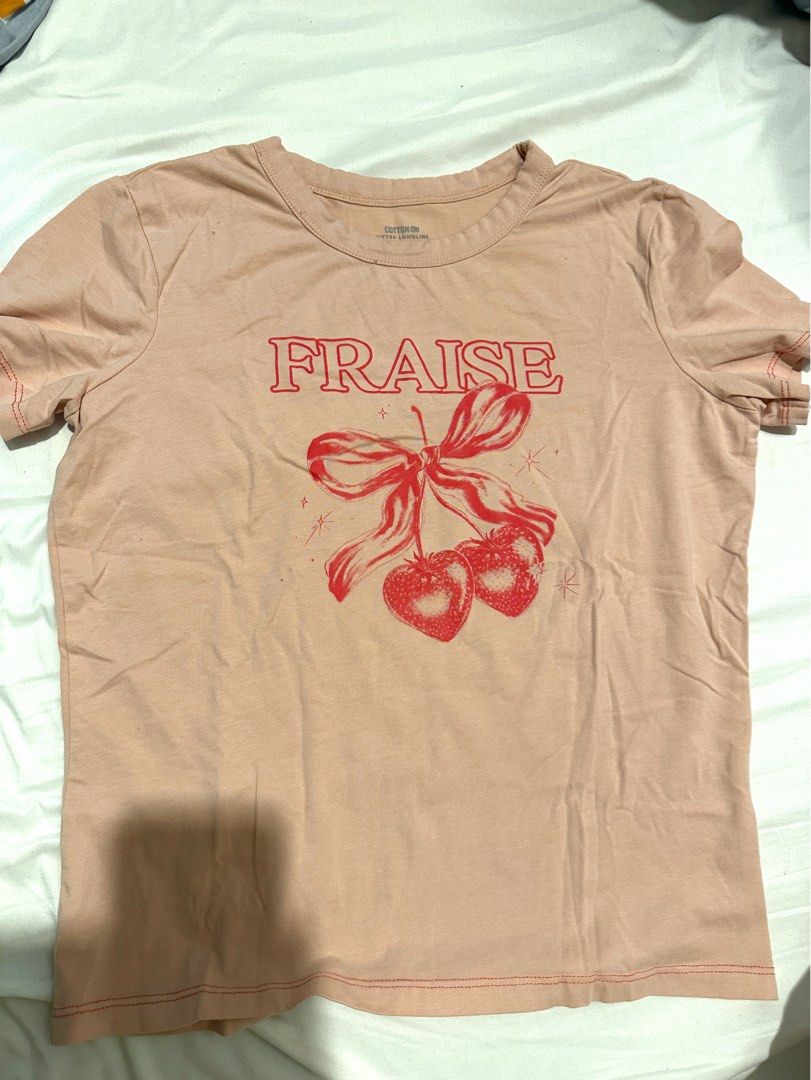 Cotton On Fraise Graphic Tee - M (Category: Shirts) located in Manila. Submitted by cchaiprincess (Listing ID 1396979849, Image 2). Description: Negotiable !! > cash first MOP: gcash rfs: decluttering used twice - Cotton On fitted longline t-shirt - Size: M - Design: Fraise graphic print - Color: Light pink - Made in Bangladesh.