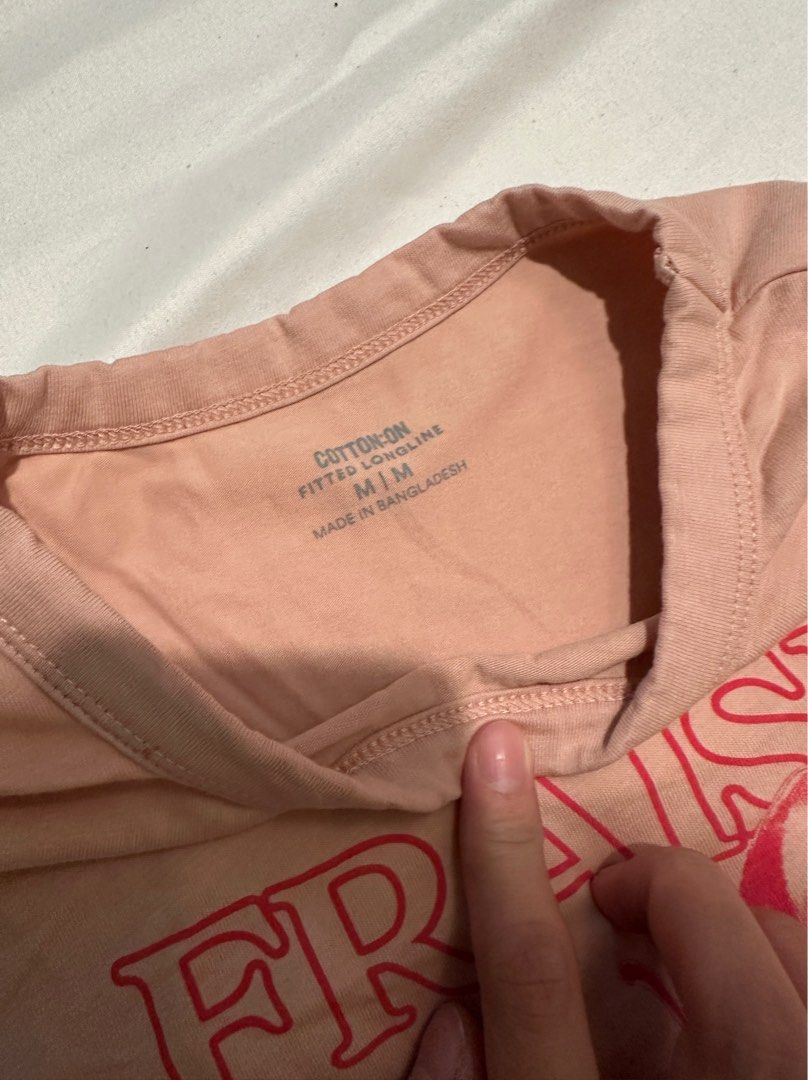 Cotton On Fraise Graphic Tee - M (Category: Shirts) located in Manila. Submitted by cchaiprincess (Listing ID 1396979849, Image 1). Description: Negotiable !! > cash first MOP: gcash rfs: decluttering used twice - Cotton On fitted longline t-shirt - Size: M - Design: Fraise graphic print - Color: Light pink - Made in Bangladesh.