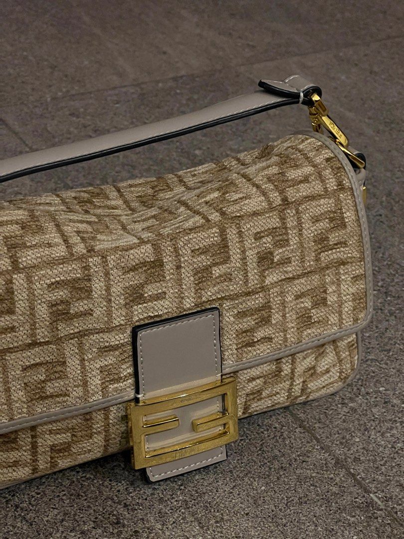 Fendi Baguette Bag (Category: Luxury Bags & Wallets) located in Santa Rosa. Submitted by _nxxy (Listing ID 1396941491, Image 2). Description: Fendi Baguette - Detachable shoulder strap - Gold-tone buckle closure - Interior zippered pocket with Fendi logo plate - Comes with box and authenticity card Minor issue: visible scratches on the logo.