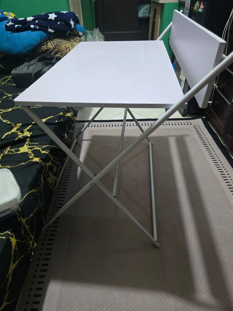 Foldable Study Table with Shelf (Category: Tables & Sets) located in Mandaluyong City. Submitted by Cathy14 (Listing ID 1396968731, Image 3). Description: ​💻 FOR SALE: Foldable Study/Computer Desk (White) 💻 (​Key Details) ​Item: Folding Study Table Desk / Foldable Computer Table ​Color: Crisp White ​Size: 80cm wide ​Price: ₱1,900.00 ​Location: Mandaluyong City ✅️​Features & Description ​This is a beautiful, large-sized table that is highly prac
