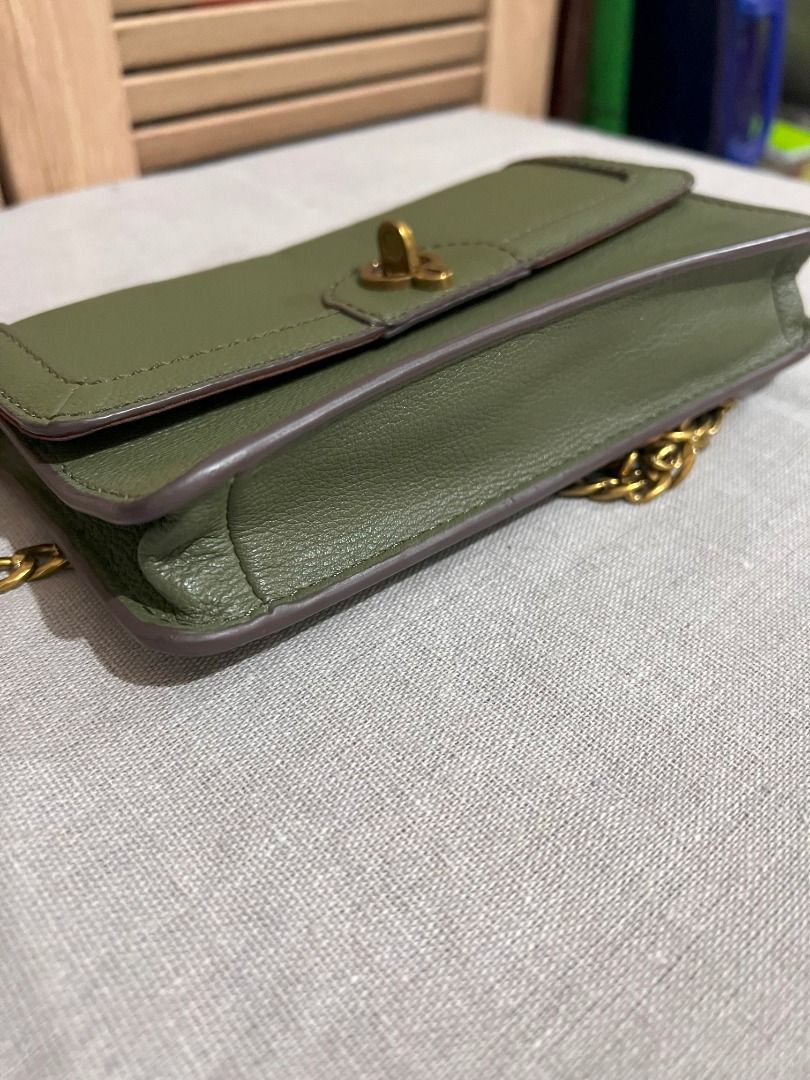 Fossil Bag - Jori Flap in Olive (Category: Luxury Bags & Wallets) located in San Fernando. Submitted by klutzy_kloset (Listing ID 1396906572, Image 2). Description: For sale: Original Fossil Bag (Wallet on Chain) bought in Australia. Item is barely used and looks like new. It features gold chain strap, clasp closure and 6 card slots. Crafted from genuine leather. Can fit an iPhone Promax and few essentials. This is a stylish complement to your ou