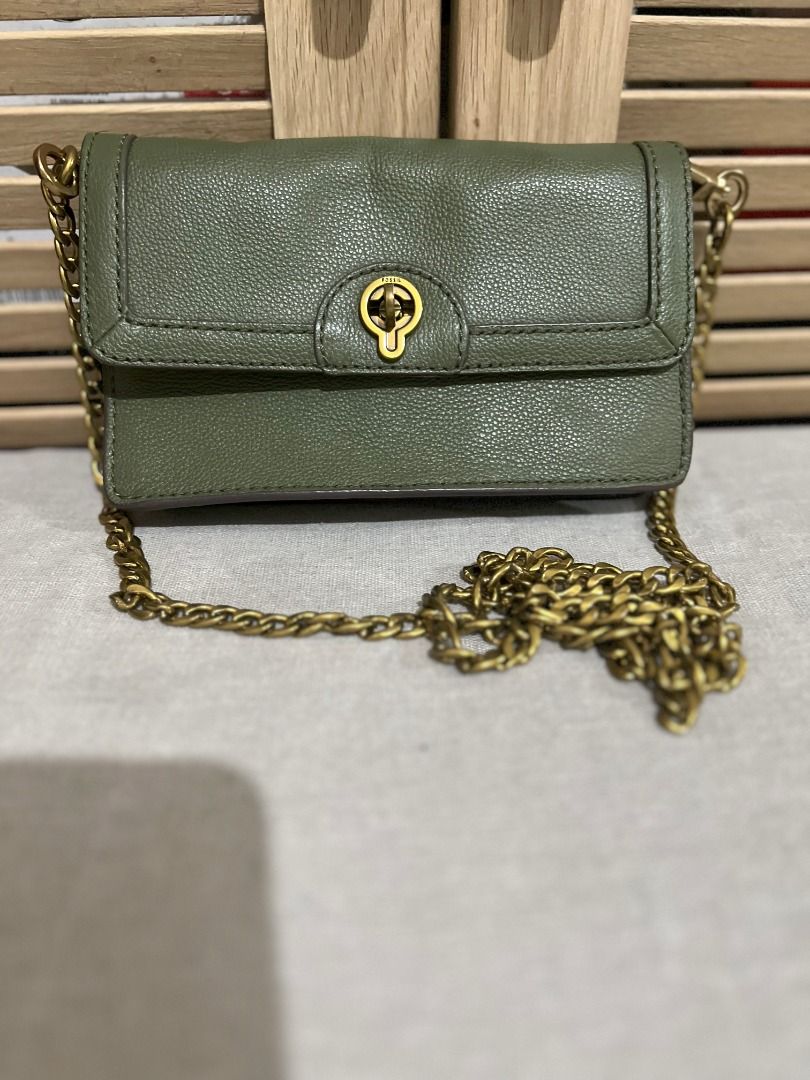 Fossil Bag - Jori Flap in Olive (Category: Luxury Bags & Wallets) located in San Fernando. Submitted by klutzy_kloset (Listing ID 1396906572, Image 1). Description: For sale: Original Fossil Bag (Wallet on Chain) bought in Australia. Item is barely used and looks like new. It features gold chain strap, clasp closure and 6 card slots. Crafted from genuine leather. Can fit an iPhone Promax and few essentials. This is a stylish complement to your ou
