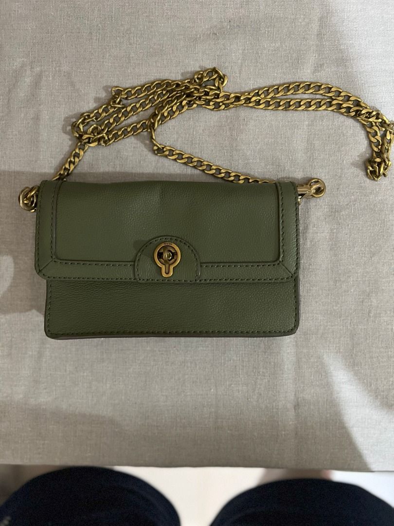 Fossil Bag - Jori Flap in Olive (Category: Luxury Bags & Wallets) located in San Fernando. Submitted by klutzy_kloset (Listing ID 1396906572, Image 3). Description: For sale: Original Fossil Bag (Wallet on Chain) bought in Australia. Item is barely used and looks like new. It features gold chain strap, clasp closure and 6 card slots. Crafted from genuine leather. Can fit an iPhone Promax and few essentials. This is a stylish complement to your ou