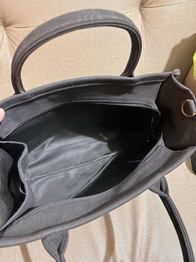 Gracegift Slytherin Tote Bag with Shoulder Strap (Category: Tote Bags) located in Marikina City. Submitted by savedbygracephb (Listing ID 1396912713, Image 2). Description: - Black Slytherin tote bag - Top handle and detachable shoulder strap (replaced) - Zippered main compartment - Small inner pocket - Gold-colored charm on zipper pull - Gracegift label - Canvas material.