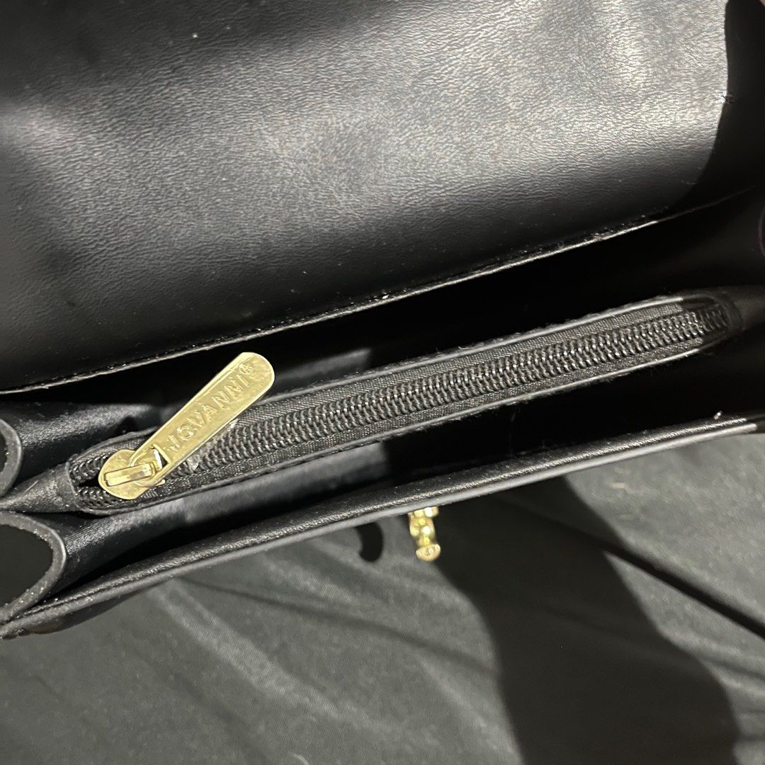 Jovanni Black Handbag (Category: Luxury Bags & Wallets) located in Manila. Submitted by yap11111 (Listing ID 1396970099, Image 3). Description: - Jovanni black handbag - Gold-tone clasp and zipper - Interior zippered pocket - Structured design - Top handle - Made of leather or leather-like material.