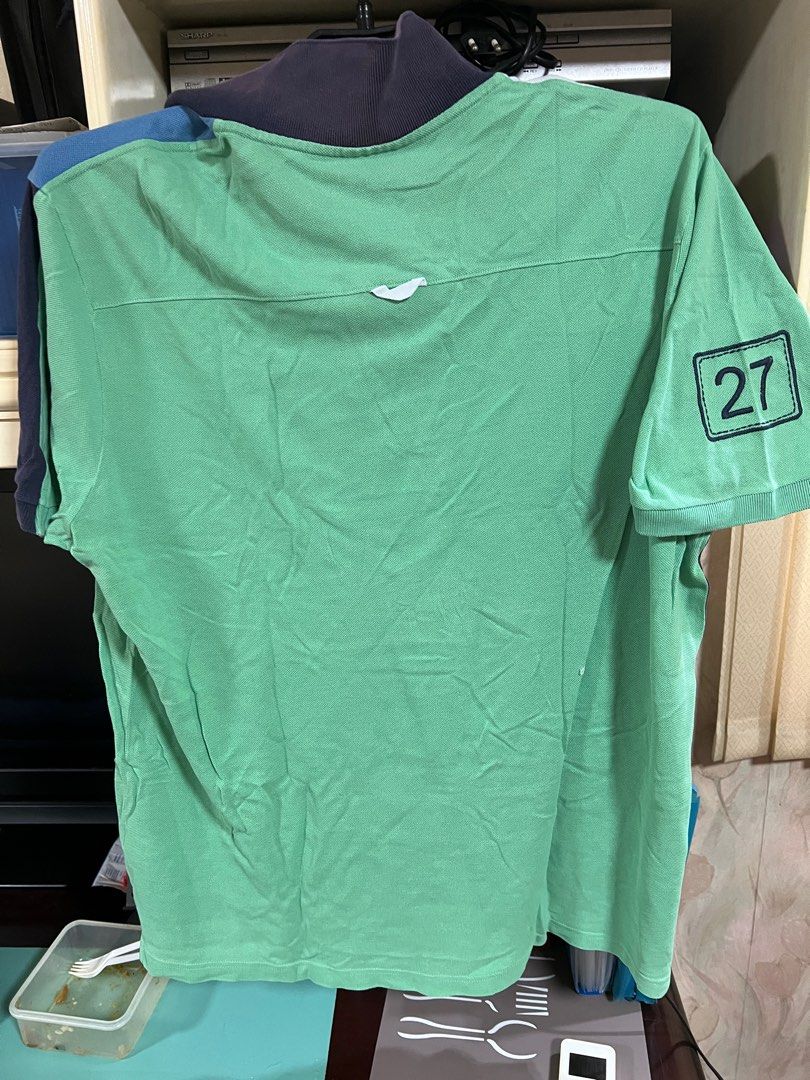 Lacoste Polo Shirt - Green (Category: Tshirts & Polo Shirts ) located in Muntinlupa City. Submitted by ms_shopph (Listing ID 1396910645, Image 2). Description: - Lacoste polo shirt - Size 8 - Color block design - Lacoste logo on chest - Number 27 on sleeve - Small hole near bottom hem - Collared neckline with button closure.