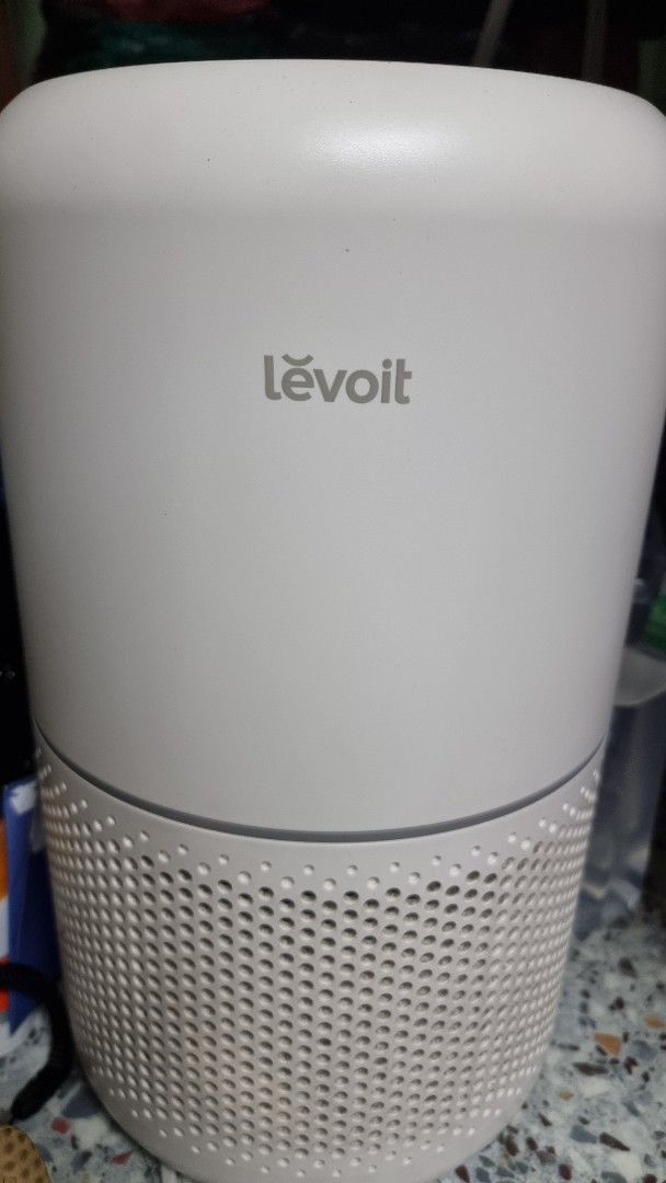 Levoit Air Purifier (Category: Air Purifiers & Dehumidifiers) located in Manila. Submitted by sosita (Listing ID 1396880497, Image 1). Description: - Sleek white Levoit air purifier. - Control panel with power, fan speed, timer, and sleep mode settings. - Cylindrical design. - Perforated air intake. no filter included.
