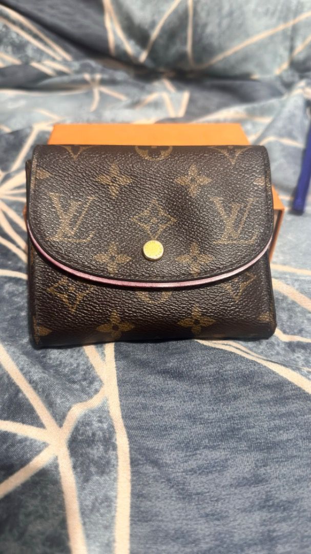 Louis Vuitton - Monogram Canvas Ariane Wallet (Category: Luxury Bags & Wallets) located in Cabuyao City. Submitted by grae__ (Listing ID 1396999759, Image 1). Description: - Authentic Louis Vuitton wallet - Iconic monogram canvas - Snap closure - Pink trim - Gold-toned hardware - Red interior - Zippered compartment - Card slots - Comes with box and legit grails. Has minor scratches in snap button and minor cracks in rubber sealing..