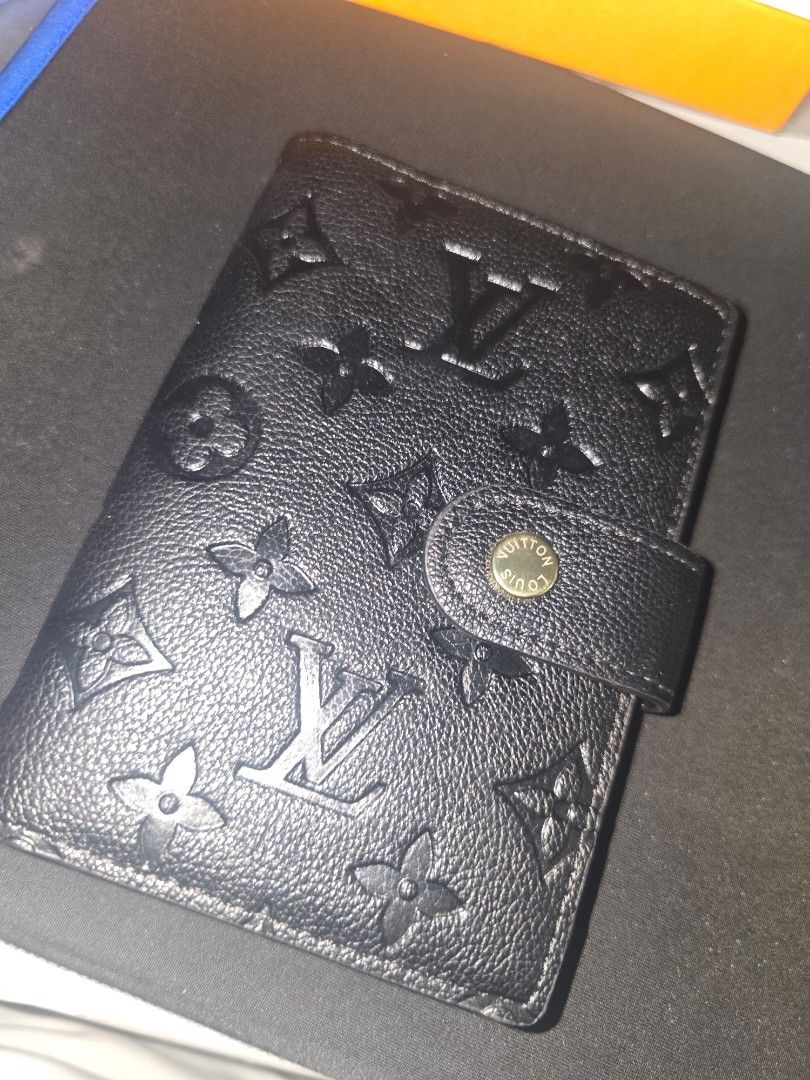 Louis Vuitton Black Embossed Planner (Category: Luxury Bags & Wallets) located in Balamban. Submitted by macabebe (Listing ID 1397003523, Image 2). Description: - Louis Vuitton planner - Black embossed leather - Includes original box and inserts (2021-2024) - Snap closure with gold-tone button - Dimensions: Approximately 5.6" height x 3.7" width - Features card slots and ring binder mechanism slight flaw is on last picture . .