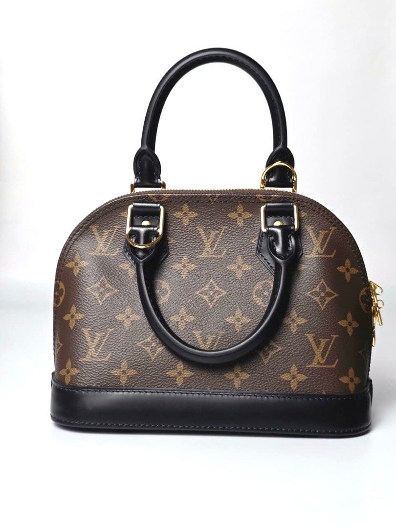 LV Monogram Alma BB (Category: Luxury Bags & Wallets) located in Pandi. Submitted by luximperium (Listing ID 1396854859, Image 2). Description: Color: Brown & Black Includes: Removable shoulder strap, Dust bag, Padlock, Leather name tag, Care card Material: Monogram Coated Canvas (Exterior) & Smooth black cowhide leather trim (Exterior), Red fabric (Interior) Size: Small Dimensions: L (23cm), H (10cm), W (11.5 cm), HD (7cm), S (112cm) Closure & P