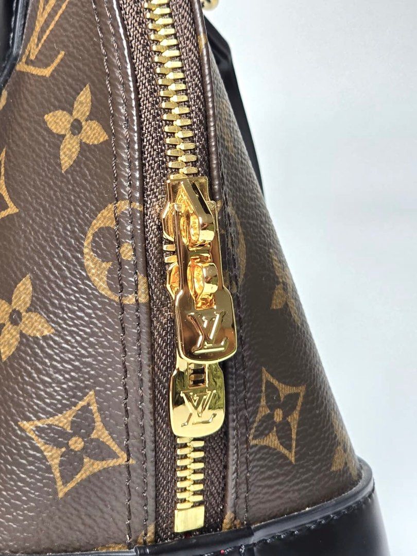 LV Monogram Alma BB (Category: Luxury Bags & Wallets) located in Pandi. Submitted by luximperium (Listing ID 1396854859, Image 3). Description: Color: Brown & Black Includes: Removable shoulder strap, Dust bag, Padlock, Leather name tag, Care card Material: Monogram Coated Canvas (Exterior) & Smooth black cowhide leather trim (Exterior), Red fabric (Interior) Size: Small Dimensions: L (23cm), H (10cm), W (11.5 cm), HD (7cm), S (112cm) Closure & P