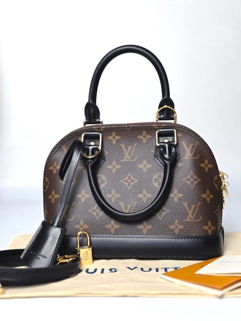 LV Monogram Alma BB (Category: Luxury Bags & Wallets) located in Pandi. Submitted by luximperium (Listing ID 1396854859, Image 1). Description: Color: Brown & Black Includes: Removable shoulder strap, Dust bag, Padlock, Leather name tag, Care card Material: Monogram Coated Canvas (Exterior) & Smooth black cowhide leather trim (Exterior), Red fabric (Interior) Size: Small Dimensions: L (23cm), H (10cm), W (11.5 cm), HD (7cm), S (112cm) Closure & P