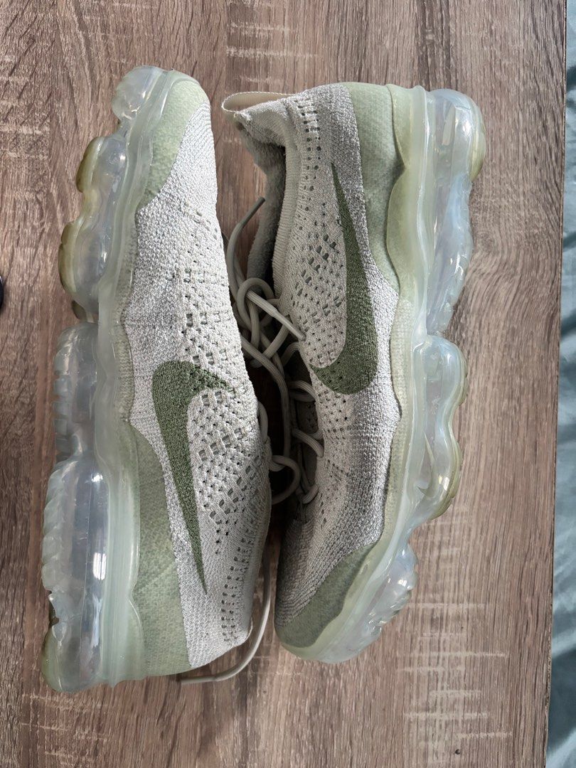 Nike Air VaporMax Flyknit 2021 (Category: Sneakers) located in Pasay City. Submitted by averycontent (Listing ID 1396880780, Image 3). Description: - Nike Air VaporMax Flyknit 2021 - Color: Light green and white - Size: US 10 - Features a breathable Flyknit upper - Full-length VaporMax Air unit for cushioning - Lace-up closure - Nike swoosh logo.