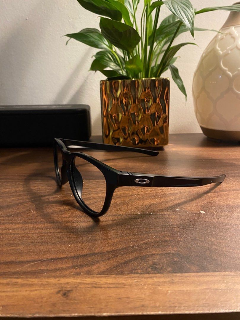 Oakley Stringer (Category: Sunglasses & Eyewear) located in Puchong. Submitted by orisajo (Listing ID 1397003720, Image 2). Description: - Black Oakley eyeglasses - Rectangular frame - Features Oakley logo on arms -size 55 - Clear lenses - Durable frame material - Suitable for everyday use.