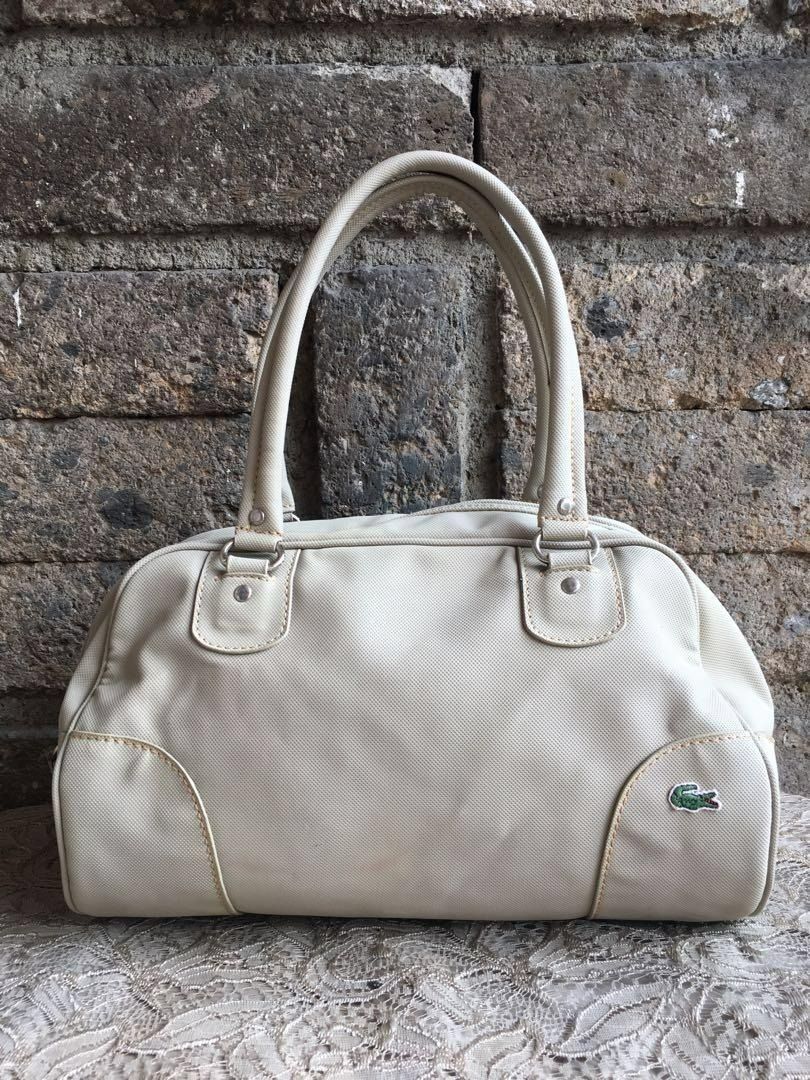 Original Lacoste Bowling Bag (Category: Shoulder Bags) located in Marikina City. Submitted by arrveefm (Listing ID 1396855741, Image 2). Description: Original Lacoste Bowling Bag Used but still in good condition; No Meet-ups; Selling at P1000.00 ONLY shipping NOT yet included (FIXED PRICE); Payment thru GCash Check pictures for visible flaws, several pictures have been provided -- "few visible ink markings as seen on pictures" Approximate Dimensi