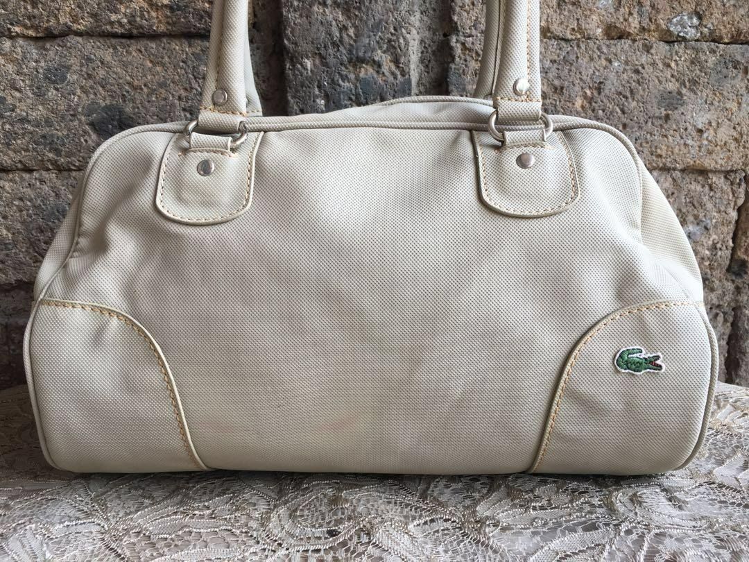 Original Lacoste Bowling Bag (Category: Shoulder Bags) located in Marikina City. Submitted by arrveefm (Listing ID 1396855741, Image 3). Description: Original Lacoste Bowling Bag Used but still in good condition; No Meet-ups; Selling at P1000.00 ONLY shipping NOT yet included (FIXED PRICE); Payment thru GCash Check pictures for visible flaws, several pictures have been provided -- "few visible ink markings as seen on pictures" Approximate Dimensi