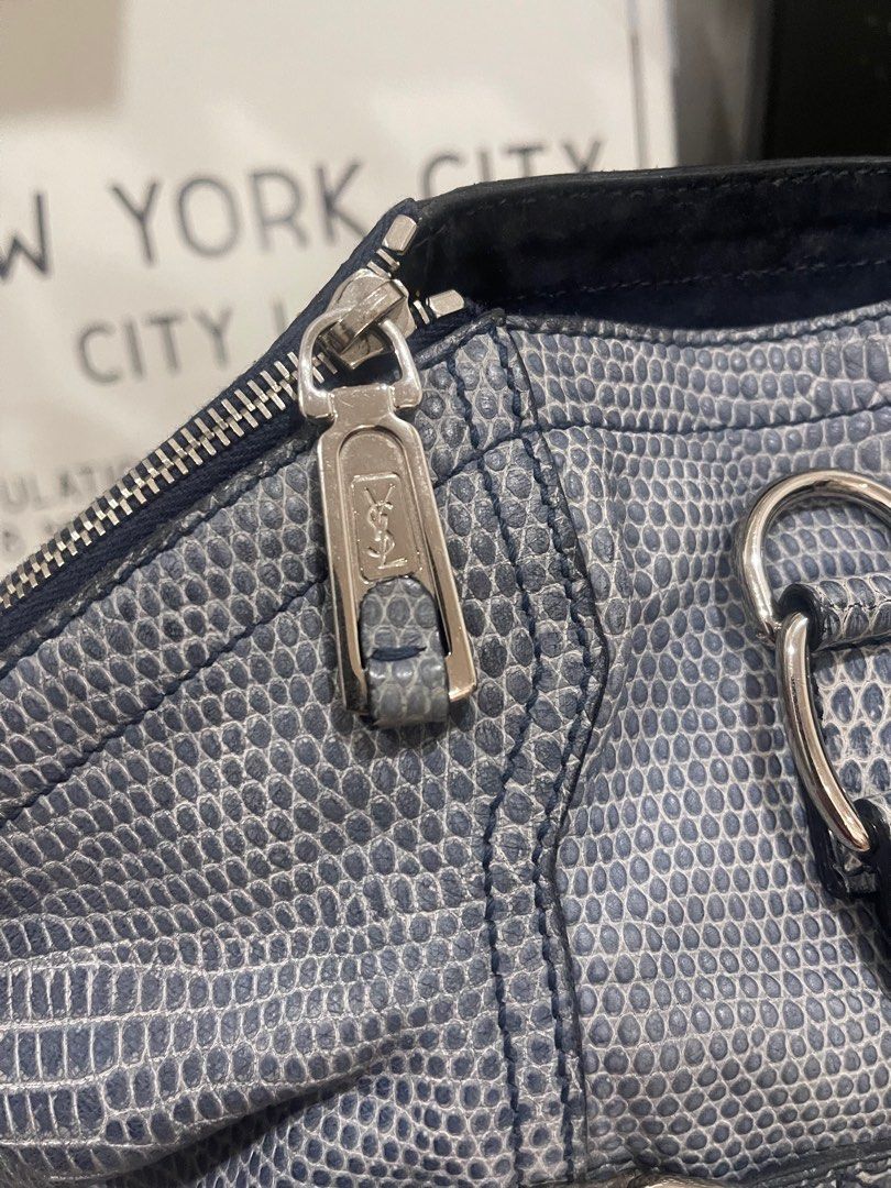 Saint Laurent Downtown Navy Blue shoulder bag (Category: Luxury Bags & Wallets) located in Subic. Submitted by dani70 (Listing ID 1396915237, Image 3). Description: - Authentic Saint Laurent Downtown handbag - Color: blue gray textured python embossed leather - Textured exterior - Double top handles - Multiple zippered compartments - Silver-tone hardware - Snap closure - Structured shape - Spacious interior - Bottom has two snap closures - sign o