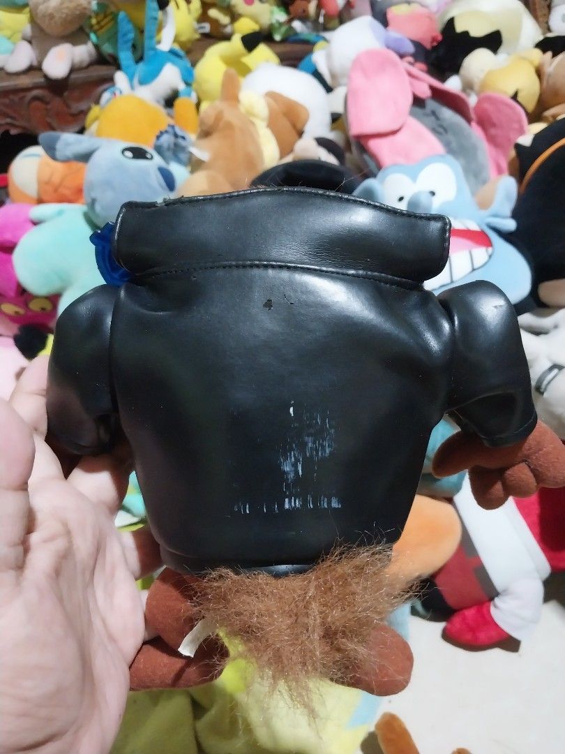 Tazmanian Devil Plush Toy (Category: Plushies & Soft Toys) located in Abucay. Submitted by g_treasures (Listing ID 1396878193, Image 2). Description: - Tazmanian Devil plush toy - Features a black jacket - Brown fur and limbs - Includes a zipper closure - Jacket has a patch - Collectible item - Great for Looney Tunes enthusiasts.