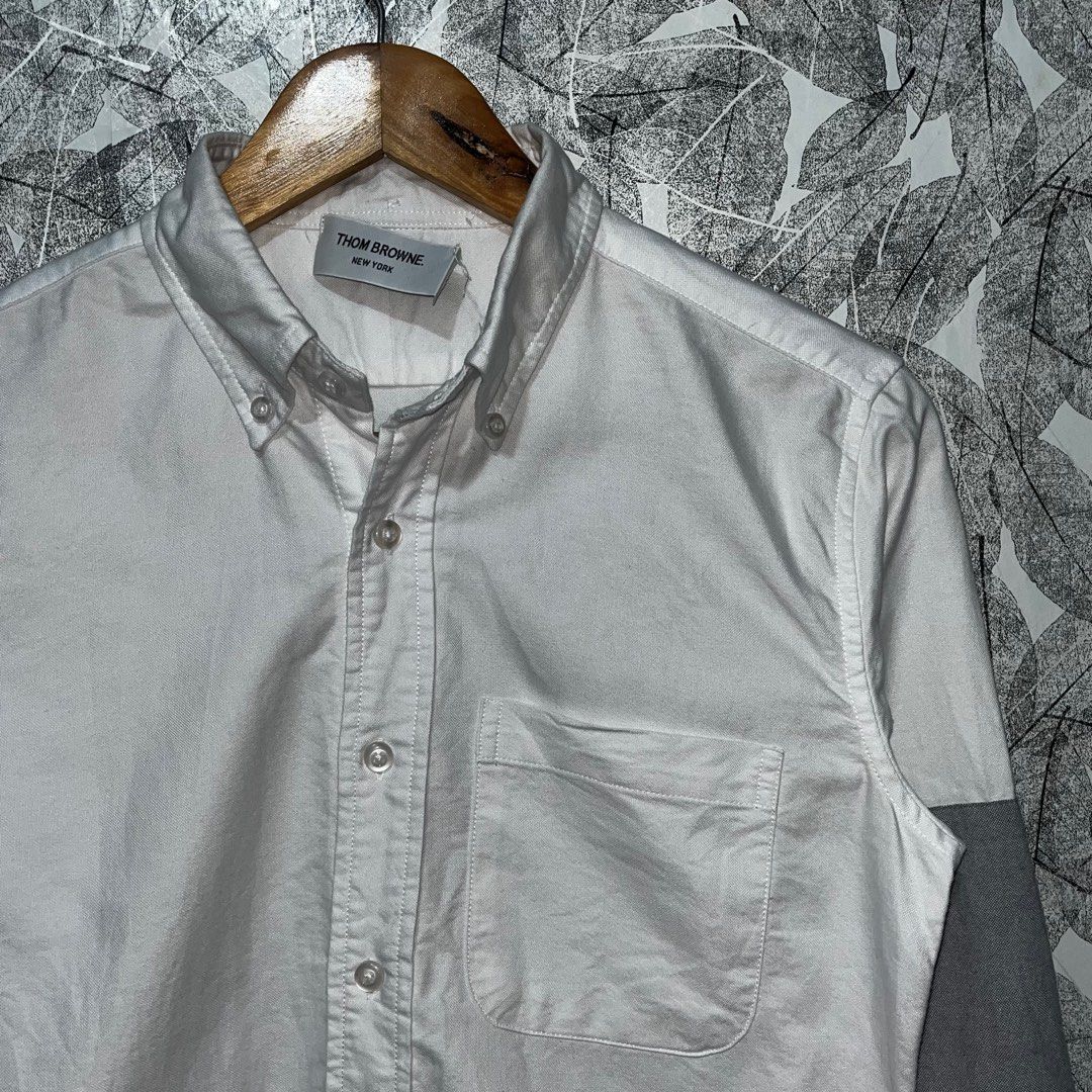 Thom Browne // White Oxford Grey Patch Shirt (Category: Luxury Apparel) located in Daraga. Submitted by th3cliquejunks (Listing ID 1397008747, Image 2). Description: Thom Browne // White Oxford Grey Patch Shirt Excellent Condition No major flaw Size 1 on tag - 19”W x 27-28”L 1,250 Dm to purchase 📲.