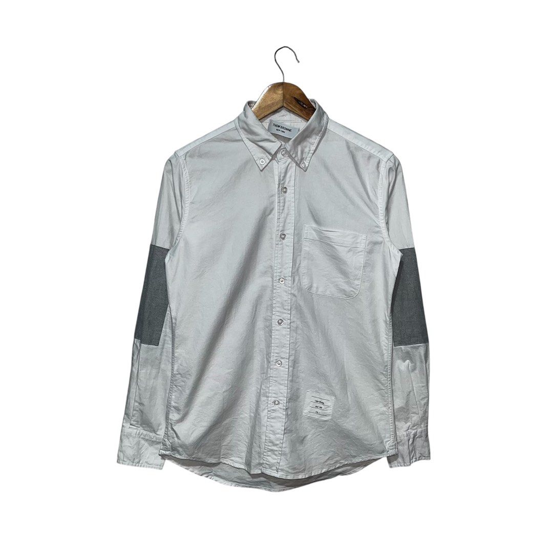 Thom Browne // White Oxford Grey Patch Shirt (Category: Luxury Apparel) located in Daraga. Submitted by th3cliquejunks (Listing ID 1397008747, Image 1). Description: Thom Browne // White Oxford Grey Patch Shirt Excellent Condition No major flaw Size 1 on tag - 19”W x 27-28”L 1,250 Dm to purchase 📲.
