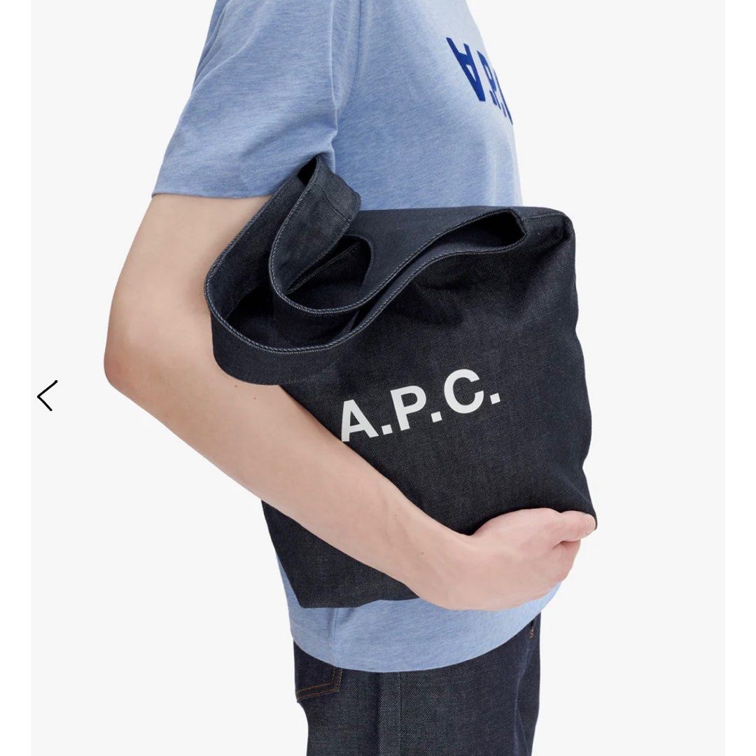 APC Ninon Tote Bag - Denim (Small) (Category: Luxury Bags & Wallets) located in Balanga. Submitted by kyleweeee (Listing ID 1397204050, Image 2). Description: - A.P.C. tote bag in dark denim. - Large main compartment. - White A.P.C. logo printed on the front. - Made of sturdy denim material. - Simple and stylish design. - Perfect for everyday use..