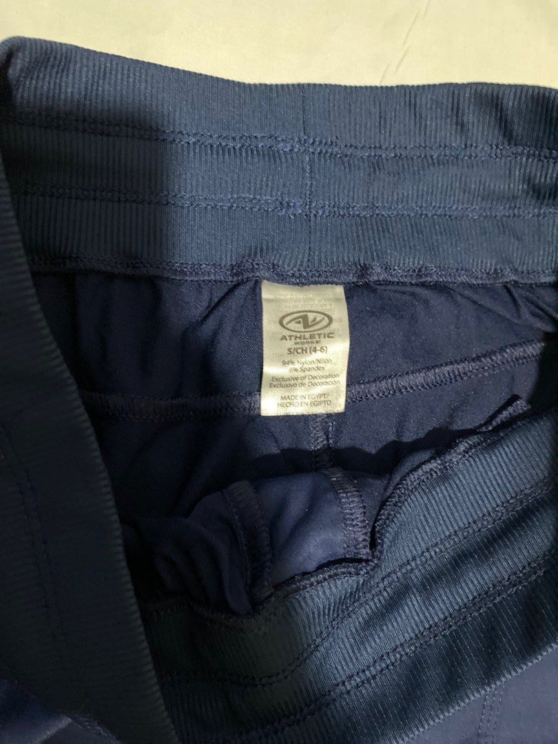 Athletic Works Navy Blue Shorts (Category: Shorts) located in San Ildefonso. Submitted by msdzer (Listing ID 1397148870, Image 3). Description: - Athletic Works shorts - Color: Navy blue - Size: S (4-6) - Features: Drawstring waist, two pockets - Waist: Approximately 26-30 inches - Length: Approximately 15 inches - Material: 94% nylon, 6% spandex.