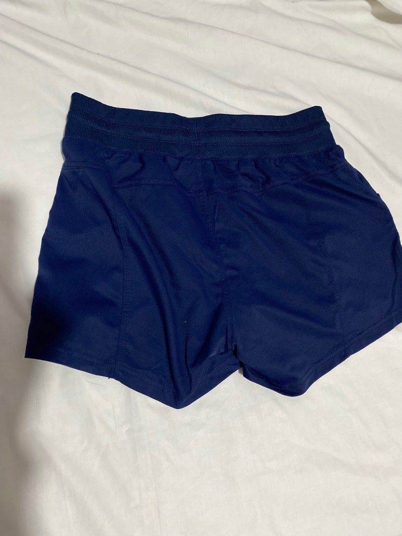Athletic Works Navy Blue Shorts (Category: Shorts) located in San Ildefonso. Submitted by msdzer (Listing ID 1397148870, Image 2). Description: - Athletic Works shorts - Color: Navy blue - Size: S (4-6) - Features: Drawstring waist, two pockets - Waist: Approximately 26-30 inches - Length: Approximately 15 inches - Material: 94% nylon, 6% spandex.