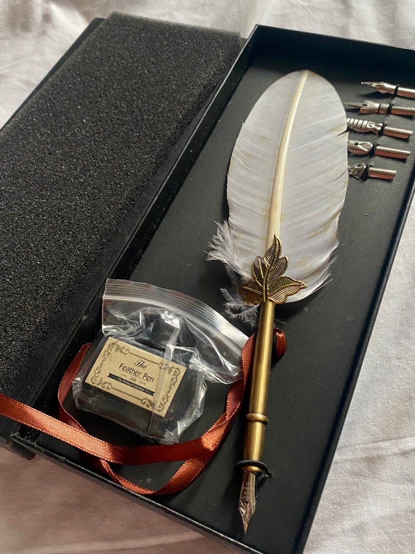 Calligraphy set white feather pen (Category: Stationery & School Supplies) located in Caloocan City. Submitted by ctrl12 (Listing ID 1397126942, Image 1). Description: never used issue: discoloration MOP: GCash MOD: J&T, Lalamove, Grab.