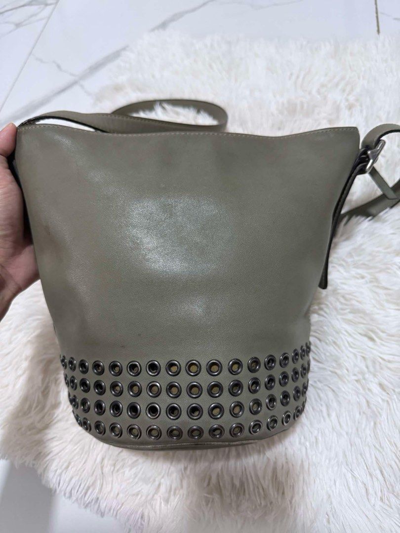 Coach Bucket Bag with Studs (Category: Luxury Bags & Wallets) located in Caloocan City. Submitted by hdrcuevas93824 (Listing ID 1397110009, Image 2). Description: - Coach bucket bag - Unique stud details - Top zipper closure - Adjustable shoulder strap - Interior pocket - Coach logo lining - Versatile neutral color.