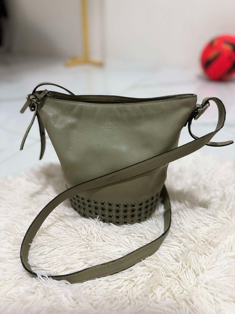 Coach Bucket Bag with Studs (Category: Luxury Bags & Wallets) located in Caloocan City. Submitted by hdrcuevas93824 (Listing ID 1397110009, Image 3). Description: - Coach bucket bag - Unique stud details - Top zipper closure - Adjustable shoulder strap - Interior pocket - Coach logo lining - Versatile neutral color.