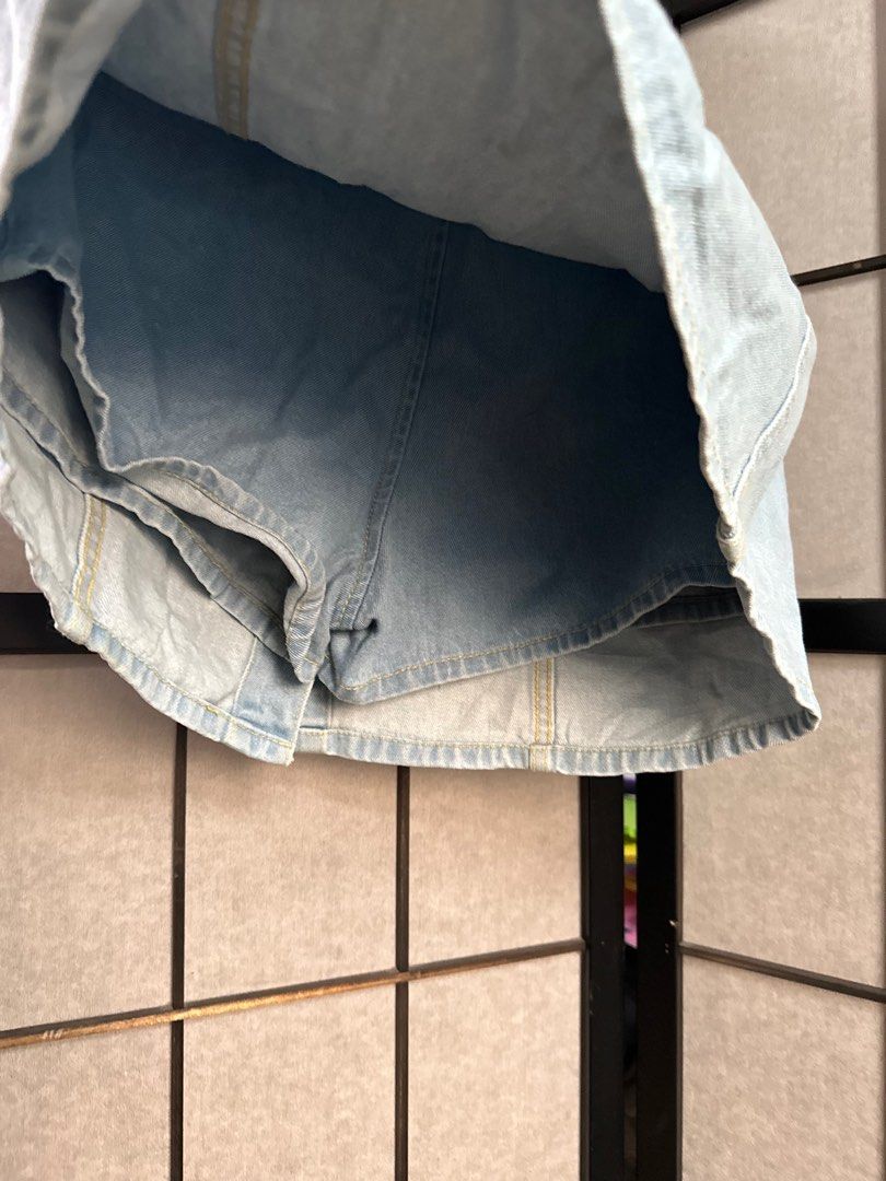 Denim Skirt - Size L (Category: Skirts) located in Manila. Submitted by echrise (Listing ID 1397140778, Image 3). Description: Waist - 30-31” Length - 15” - HSTYLE JEANS denim skirt - Light blue wash - Size L - A-line style - Button-up front - Built-in shorts lining - Minor stains present - Non-stretch.
