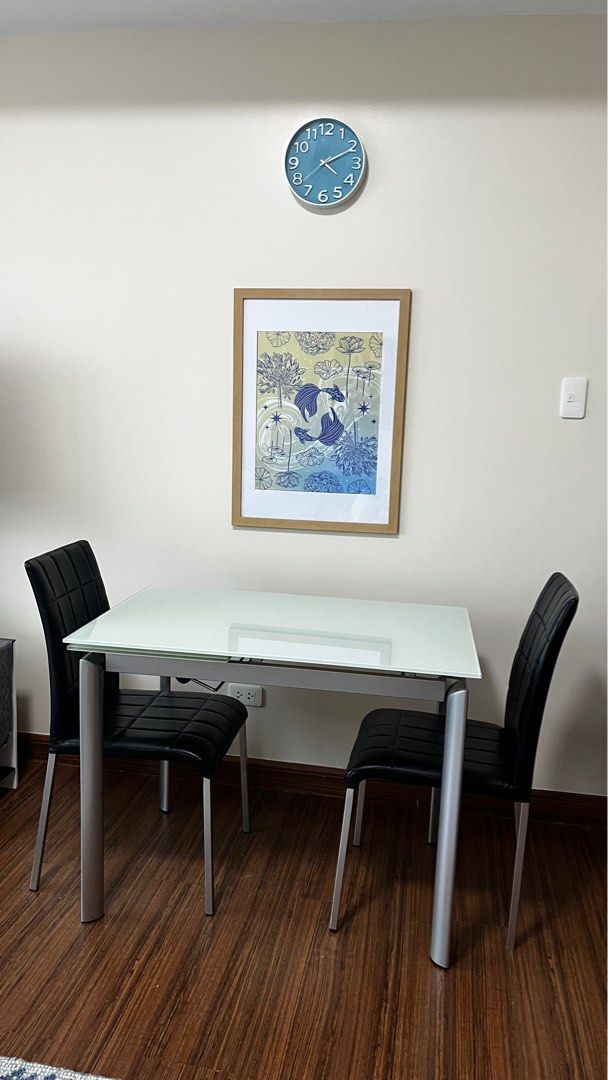Expandable Tempered Frosted Glass Dining Set (Category: Tables & Sets) located in Makati City. Submitted by amanda.sells (Listing ID 1397118530, Image 1). Description: 100cm length when not extended, 140cm when extended Sturdy and stable dining table High quality build Tempered glass Expandable from 4 seater to 6 seater Comes with 2 dining chairs Powder coated steel legs .