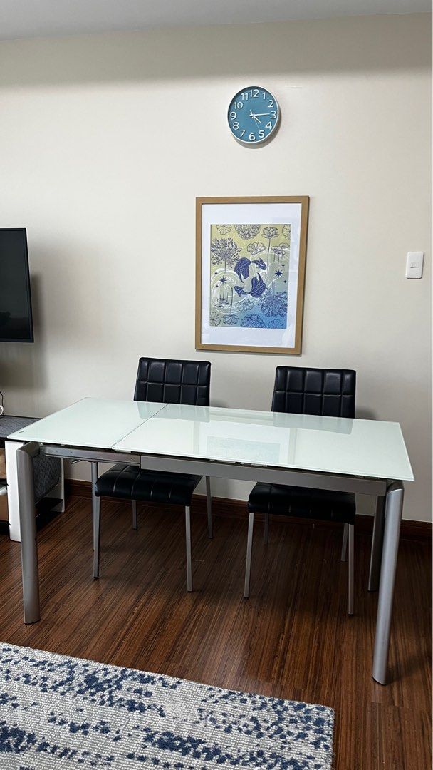 Expandable Tempered Frosted Glass Dining Set (Category: Tables & Sets) located in Makati City. Submitted by amanda.sells (Listing ID 1397118530, Image 2). Description: 100cm length when not extended, 140cm when extended Sturdy and stable dining table High quality build Tempered glass Expandable from 4 seater to 6 seater Comes with 2 dining chairs Powder coated steel legs .