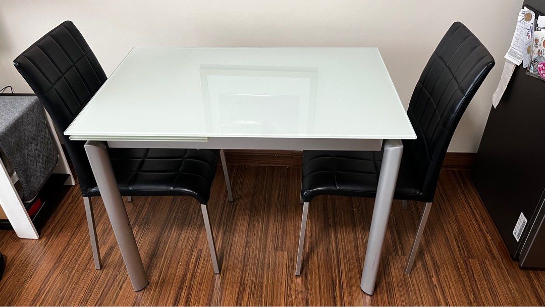 Expandable Tempered Frosted Glass Dining Set (Category: Tables & Sets) located in Makati City. Submitted by amanda.sells (Listing ID 1397118530, Image 3). Description: 100cm length when not extended, 140cm when extended Sturdy and stable dining table High quality build Tempered glass Expandable from 4 seater to 6 seater Comes with 2 dining chairs Powder coated steel legs .