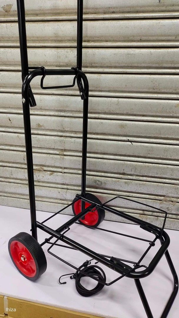 Folding Trolley (Category: Strollers) located in Manila. Submitted by lyfrancois14 (Listing ID 1397038441, Image 2). Description: - Foldable h - Sturdy black frame - Red wheels - Comfortable handle - Folds for easy storage - Ideal for moving boxes and groceries - Durable and easy to use.