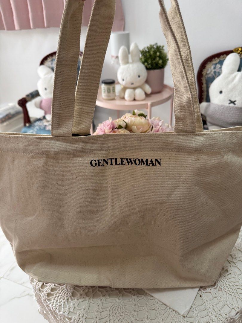 Gentlewoman Tote Bag (Category: Tote Bags) located in Marikina City. Submitted by bee031297 (Listing ID 1397098672, Image 2). Description: - Gentlewoman tote bag - Neutral color - Large front pocket - Brand name printed on front - Includes tag - Two handles.