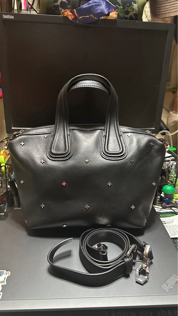 Givenchy Antigona Small Crossbody Bag (Category: Luxury Bags & Wallets) located in Taytay. Submitted by jp4_fashion_hub (Listing ID 1397071262, Image 1). Description: - Givenchy Antigona Small crossbody bag - Black color - Silver-tone hardware with cross studs - Detachable shoulder strap - Interior zip pocket - Givenchy label inside - Top zip closure - Dual top handles - Serial number: 12B0137.