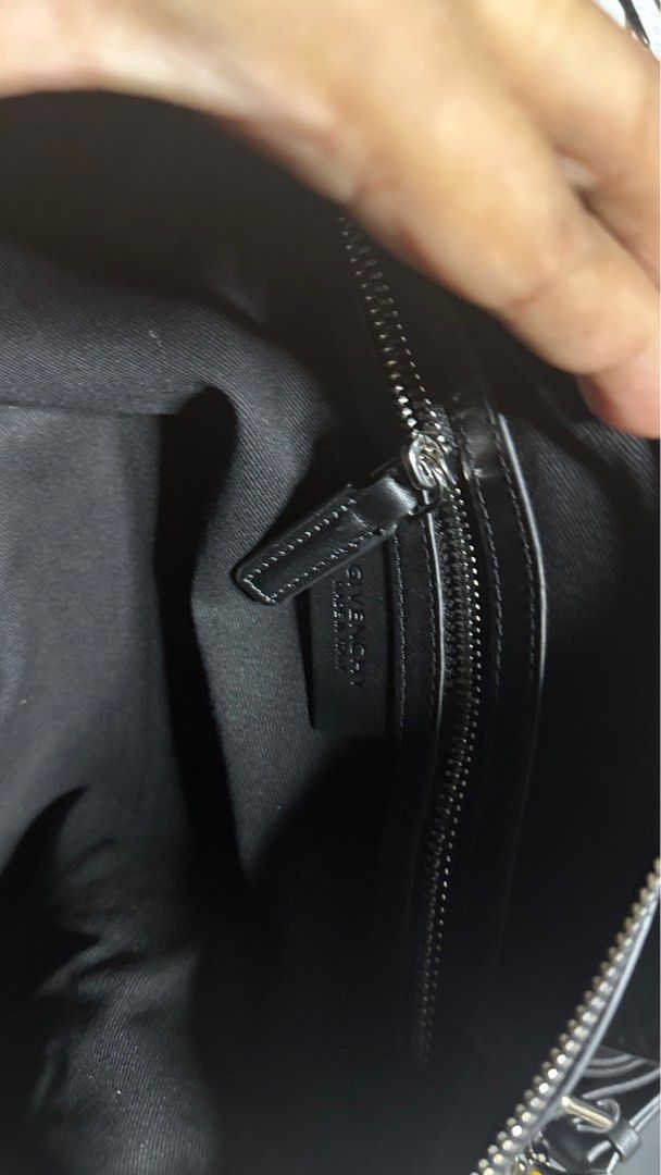 Givenchy Antigona Small Crossbody Bag (Category: Luxury Bags & Wallets) located in Taytay. Submitted by jp4_fashion_hub (Listing ID 1397071262, Image 3). Description: - Givenchy Antigona Small crossbody bag - Black color - Silver-tone hardware with cross studs - Detachable shoulder strap - Interior zip pocket - Givenchy label inside - Top zip closure - Dual top handles - Serial number: 12B0137.