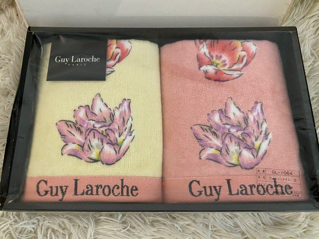 Guy Laroche Paris Towel Set (Category: Bedding & Towels) located in Manila. Submitted by star_section (Listing ID 1397165413, Image 2). Description: - Guy Laroche Paris towel set - Includes two towels: - Light yellow - Pink - Each towel features a floral design and the Guy Laroche logo. - Presented in a black box with the brand name..