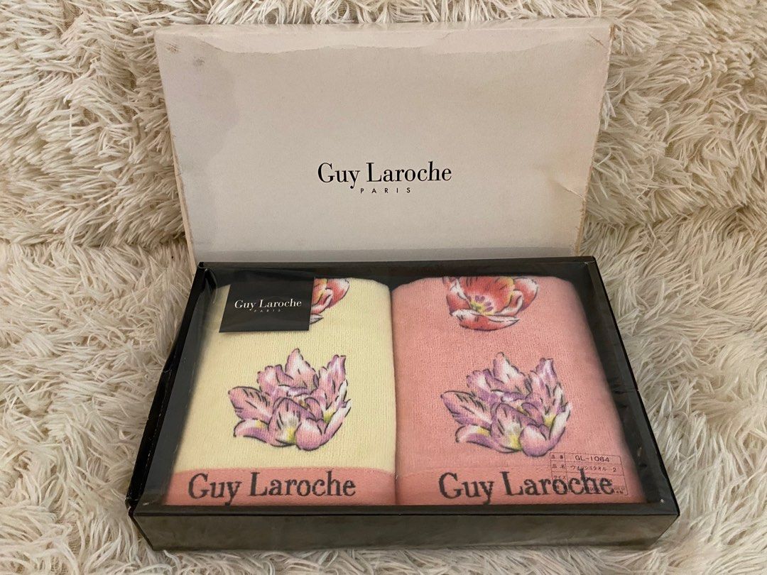 Guy Laroche Paris Towel Set (Category: Bedding & Towels) located in Manila. Submitted by star_section (Listing ID 1397165413, Image 1). Description: - Guy Laroche Paris towel set - Includes two towels: - Light yellow - Pink - Each towel features a floral design and the Guy Laroche logo. - Presented in a black box with the brand name..