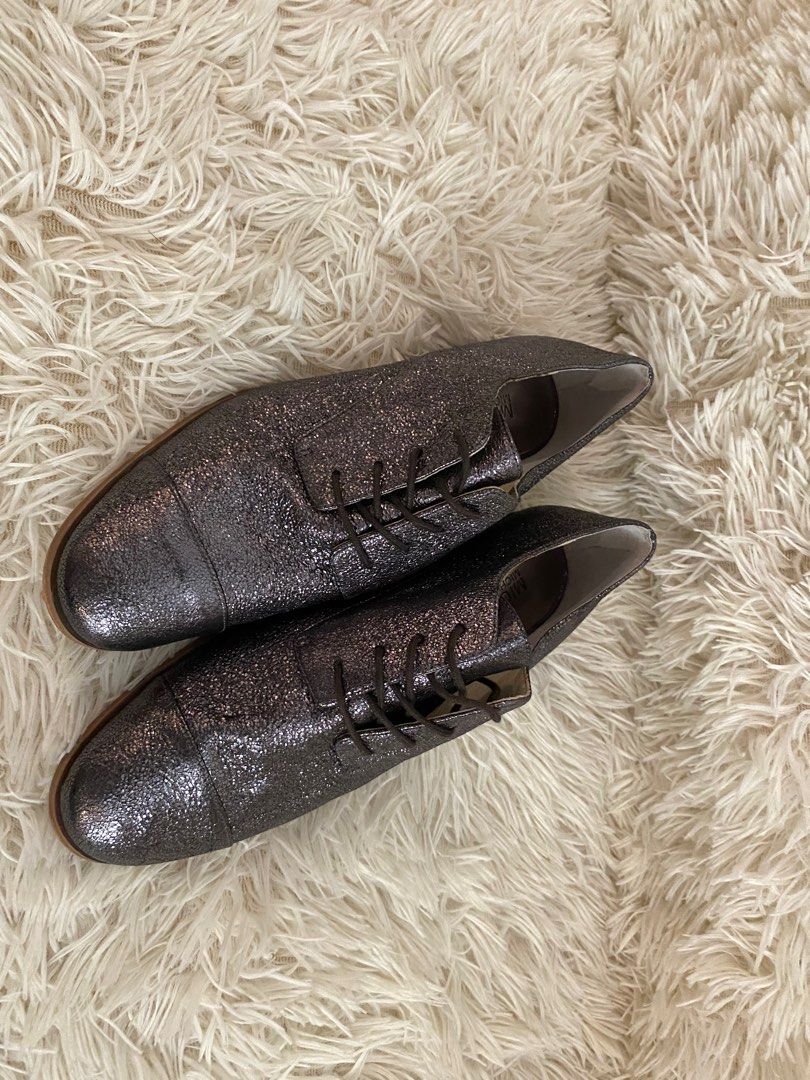 Michael Kors Glitter Oxford Shoes (Category: Sneakers) located in Manila. Submitted by star_section (Listing ID 1397163955, Image 2). Description: - Michael Kors oxford shoes - Size: 7M - Glitter finish - Classic lace-up design - Pointed toe - Light brown soles - Michael Kors logo on interior - Adds sparkle to any outfit.