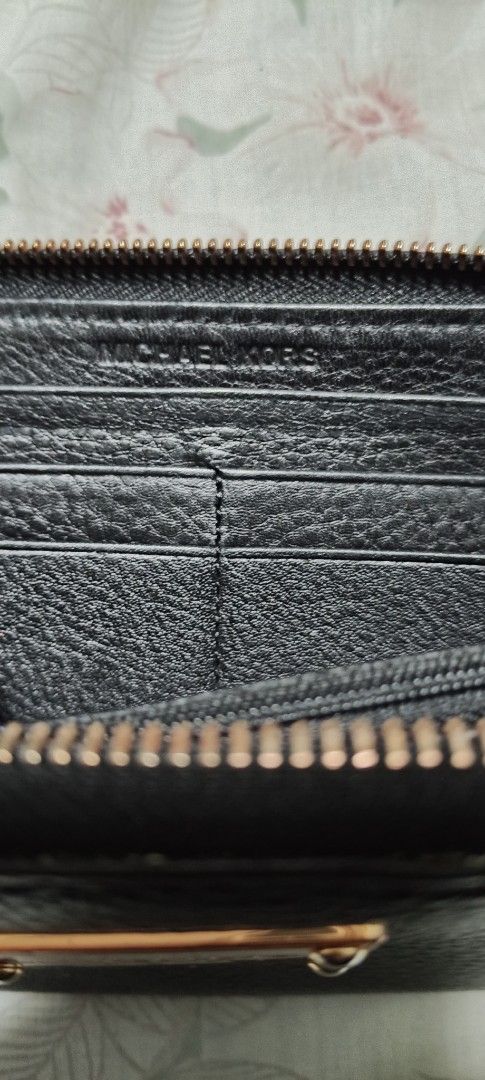 Michael Kors Zip Around Wallet (Category: Wallets & Card holders) located in Calamba. Submitted by mel013 (Listing ID 1397054136, Image 2). Description: - Michael Kors black zip-around wallet - Gold-tone metal plate and zipper - Features 'EST. 1981' - Multiple card slots and compartments - Made of leather.