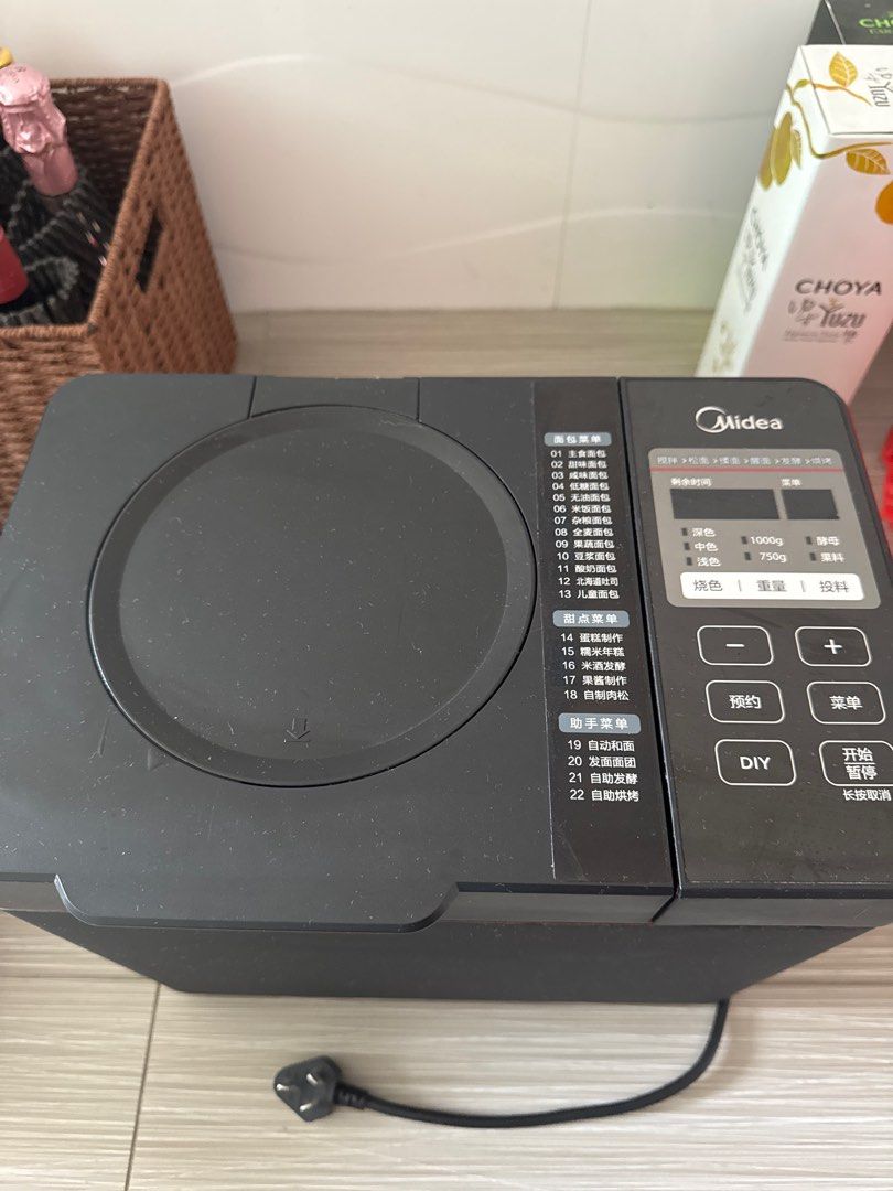 Midea Bread Maker (Category: Breadmakers) located in Singapore. Submitted by kuahb (Listing ID 1397036089, Image 2). Description: - Used Midea bread maker - Multiple pre-set programs - Crust color settings - Loaf size settings - Good working condition.