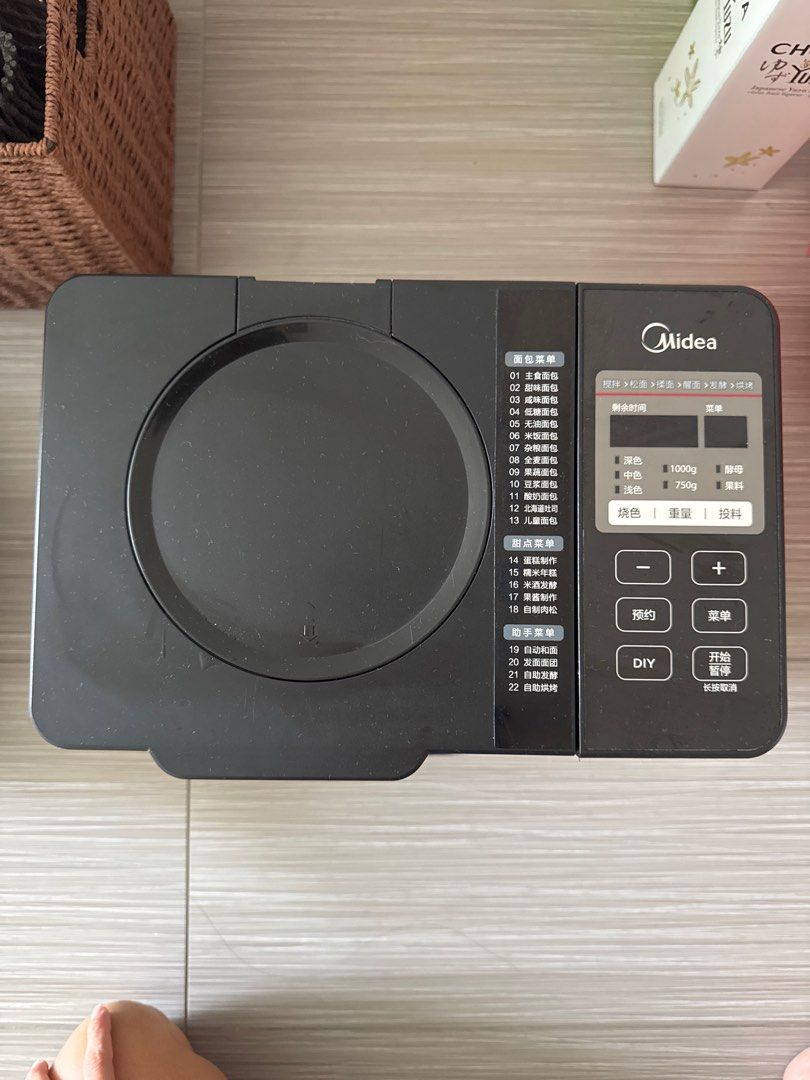 Midea Bread Maker (Category: Breadmakers) located in Singapore. Submitted by kuahb (Listing ID 1397036089, Image 3). Description: - Used Midea bread maker - Multiple pre-set programs - Crust color settings - Loaf size settings - Good working condition.
