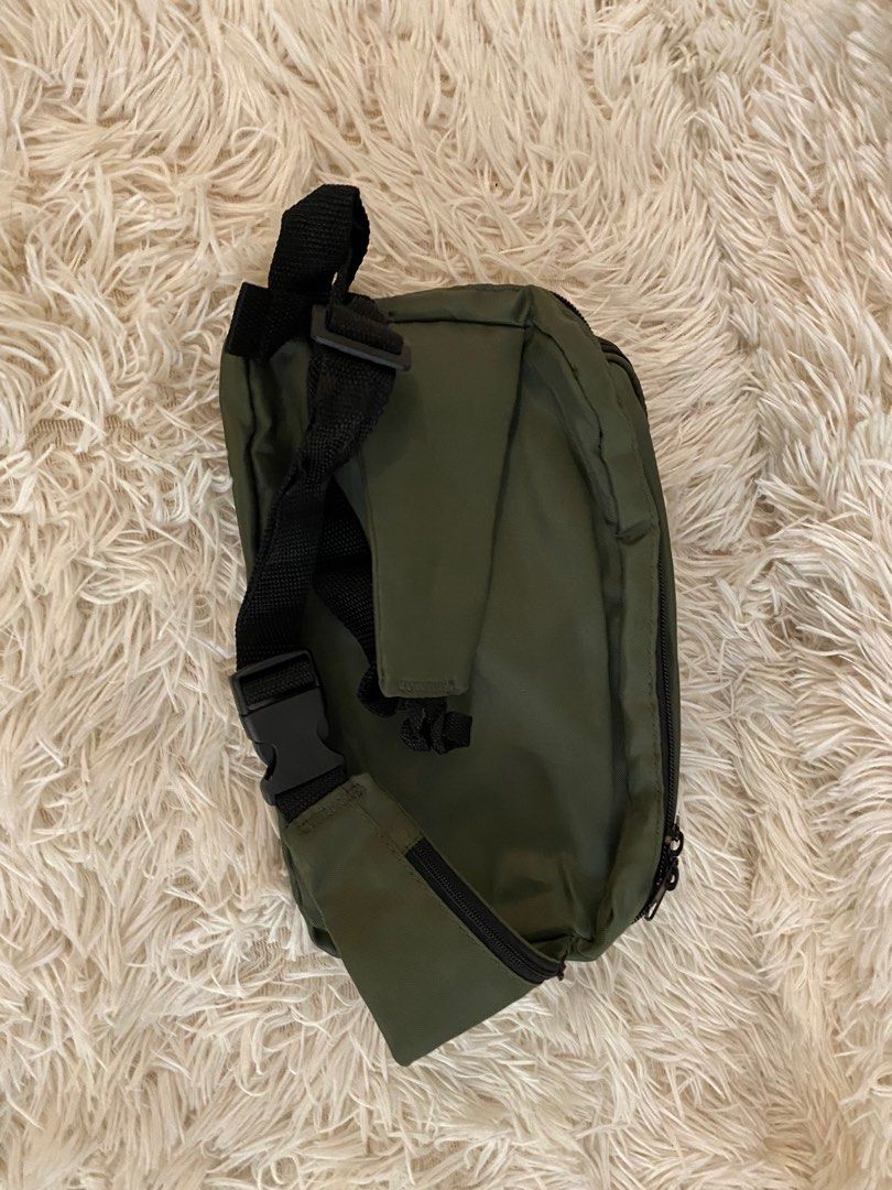 Olive Green Sling Bag (Category: Cross-body Bags) located in Manila. Submitted by star_section (Listing ID 1397156474, Image 2). Description: - Olive green sling bag - Multiple compartments - Main zippered compartment - Front pocket - Adjustable black strap - Black interior - Ideal for phone, wallet, and keys - Great for everyday or travel use.
