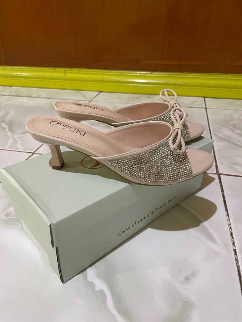 Suki Beige Heels with Bow (Category: Heels) located in Las Pinas. Submitted by jessicamaev (Listing ID 1397140148, Image 2). Description: - Suki beige heels - Size 38 - Features bow and embellished upper - Small heel height - Comes with original box - Ideal for special occasions or everyday wear.