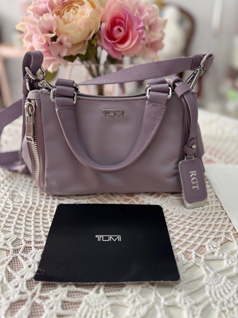 Tumi Voyageur Carson Crossbody Bag (Category: Luxury Bags & Wallets) located in Marikina City. Submitted by bee031297 (Listing ID 1397092140, Image 3). Description: - Tumi Voyageur Carson crossbody bag - Lavender color - Top handle and detachable shoulder strap - Zippered side pocket - Main compartment with interior pocket - Gray interior lining - Includes Tumi tag and card.